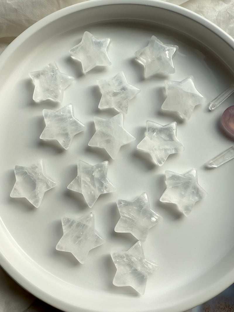 An array of clear quartz stars shown on a white plate