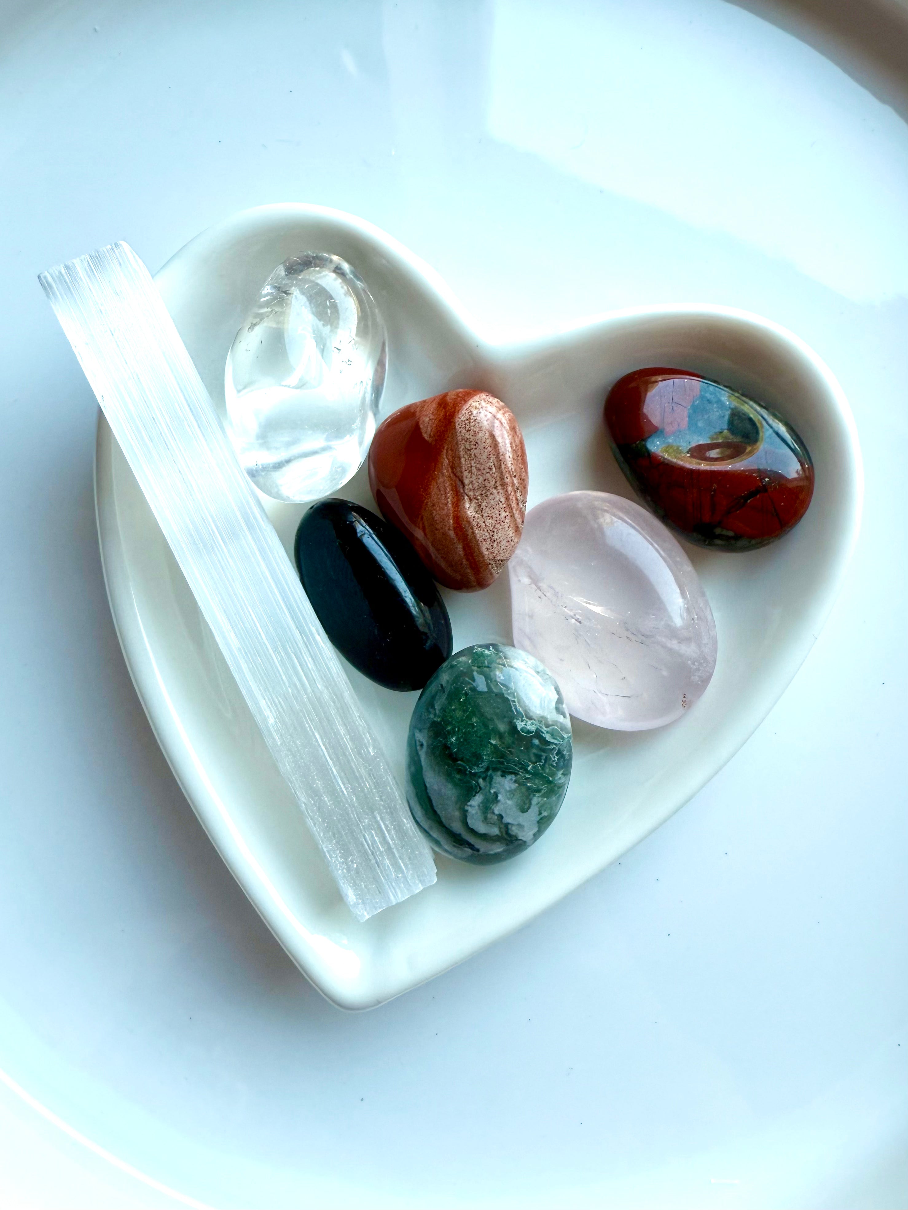 Healing stones in optional white heart bowl, including Selenite, Moss Agate, and Clear Quartz