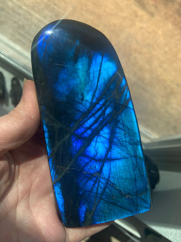 Very Blue, Very Flashy big Labradorite Freeform Statement Piece Crystal. The tall rounded oval shape is especially attractive + will make a magical addition to your sacred space.