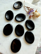 Group of 8 polished Black Obsidian worry stones – pocket-sized crystals for anxiety, grounding + spiritual balance