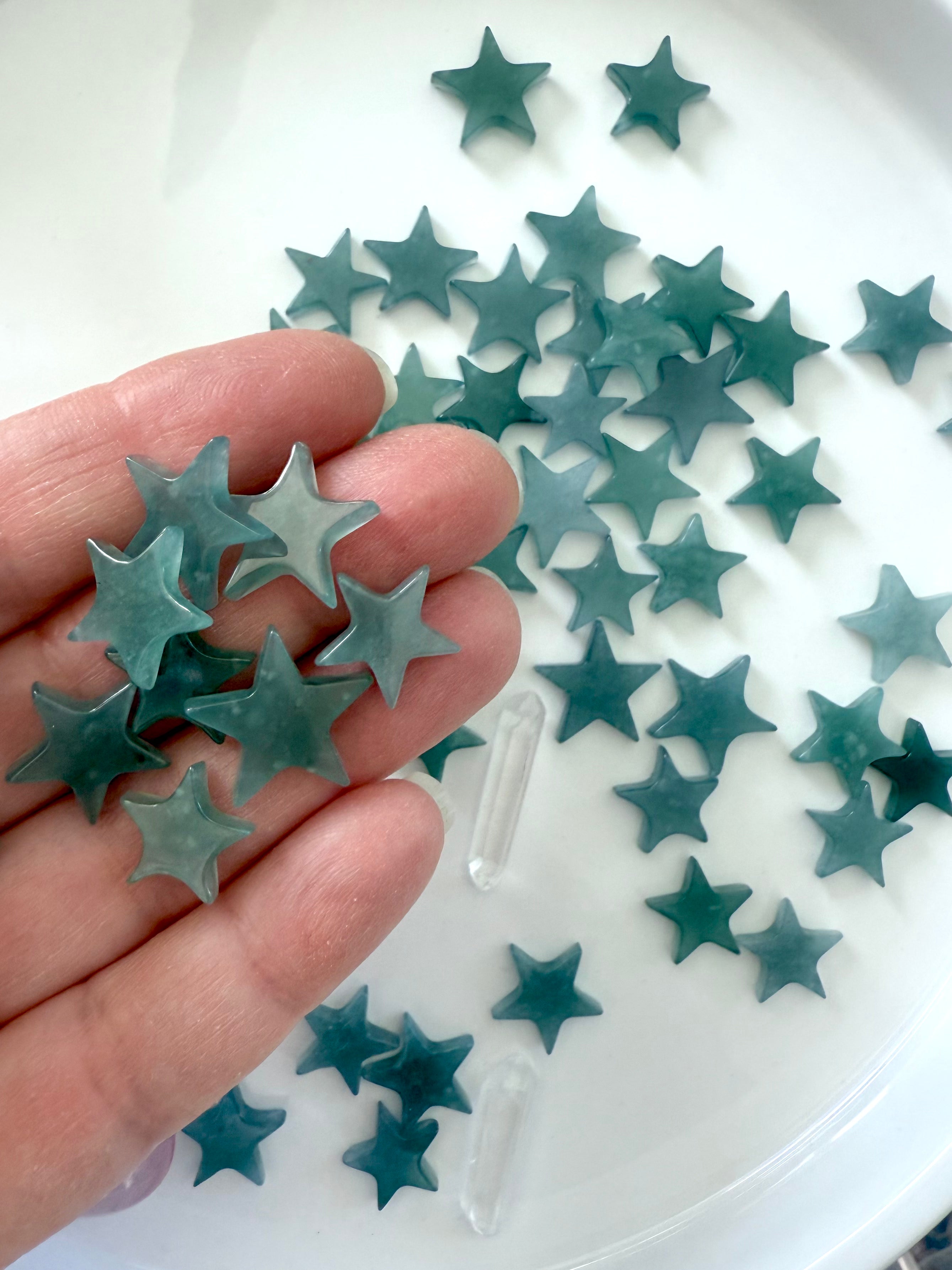 Mini Blue Water Jade Stars shown on my hand for scale
