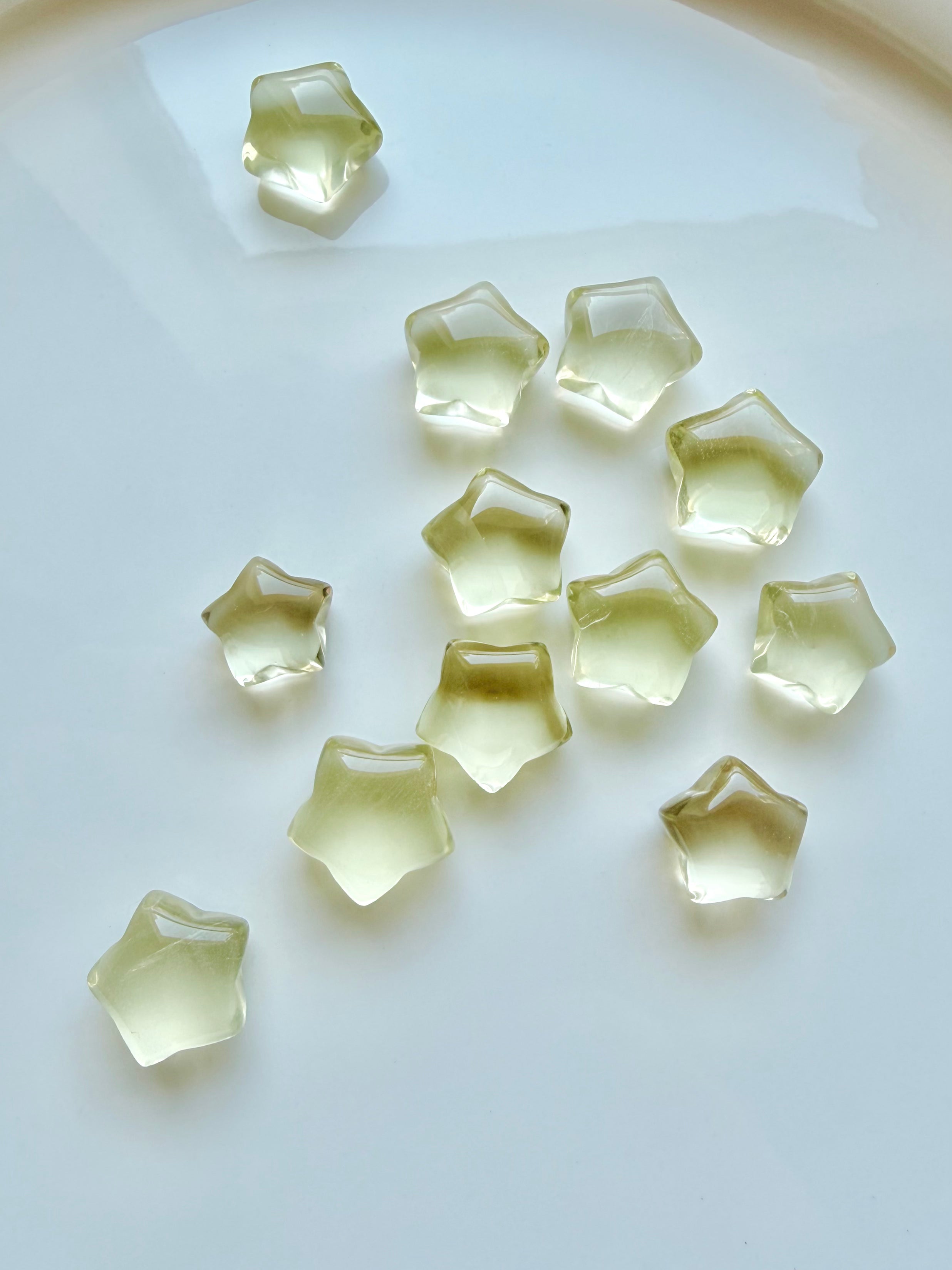 Mini Lemon Citrine stars showing translucent golden-yellow color and subtle natural crystalline patterns