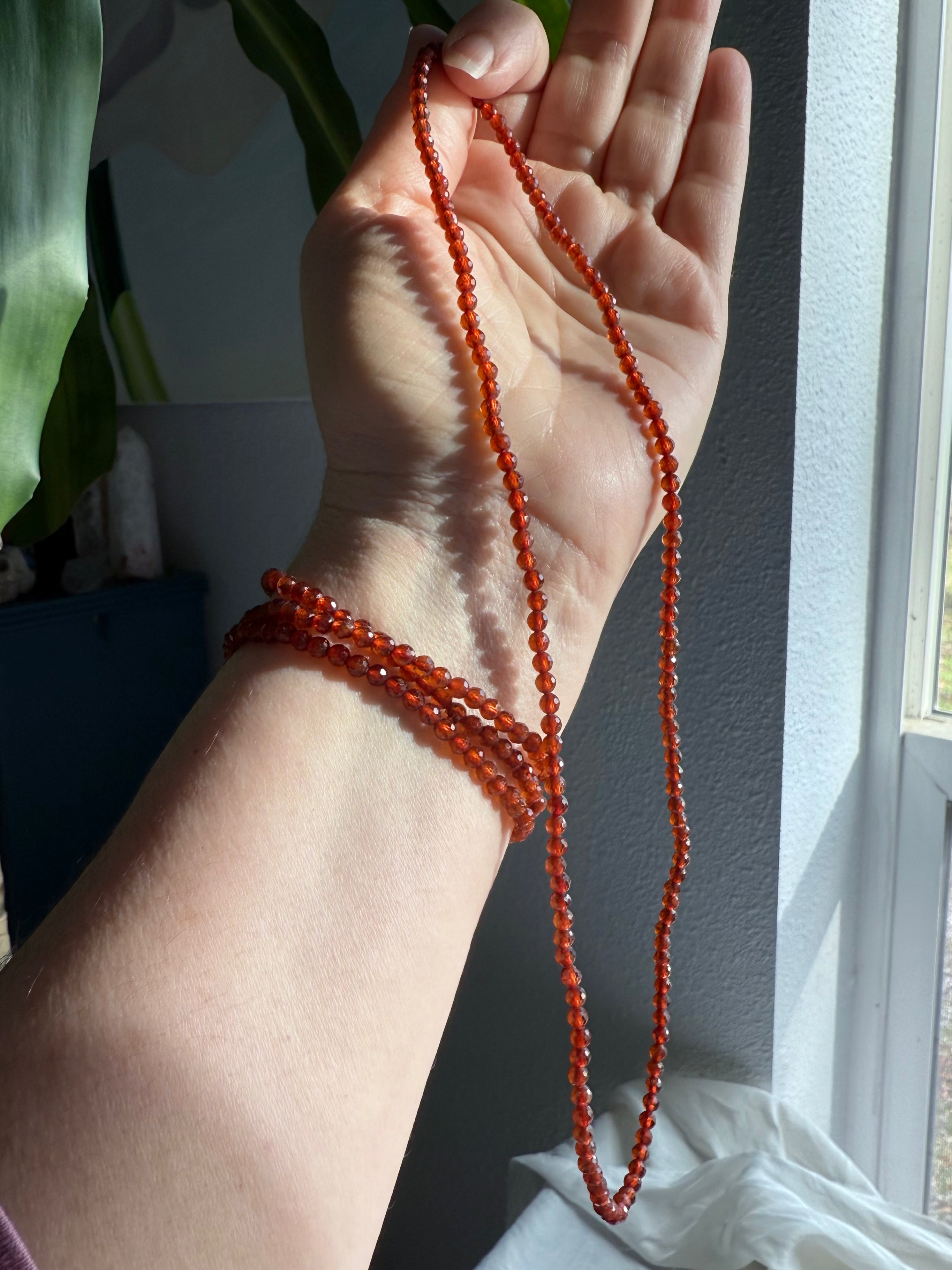 Our sparkly faceted Spessartite Garnets can be worn as a Wrap Bracelet or Necklace