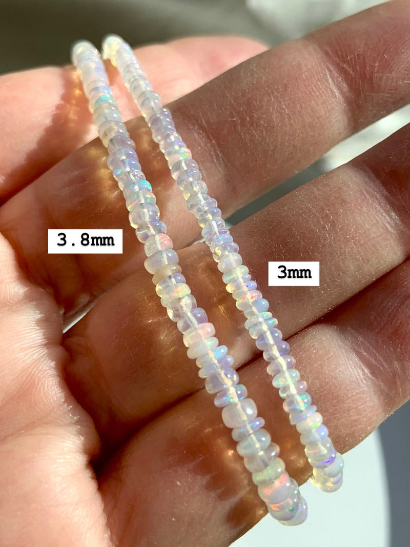 Comparison of the two bead sizes available in our Ethiopian Opal Bracelets