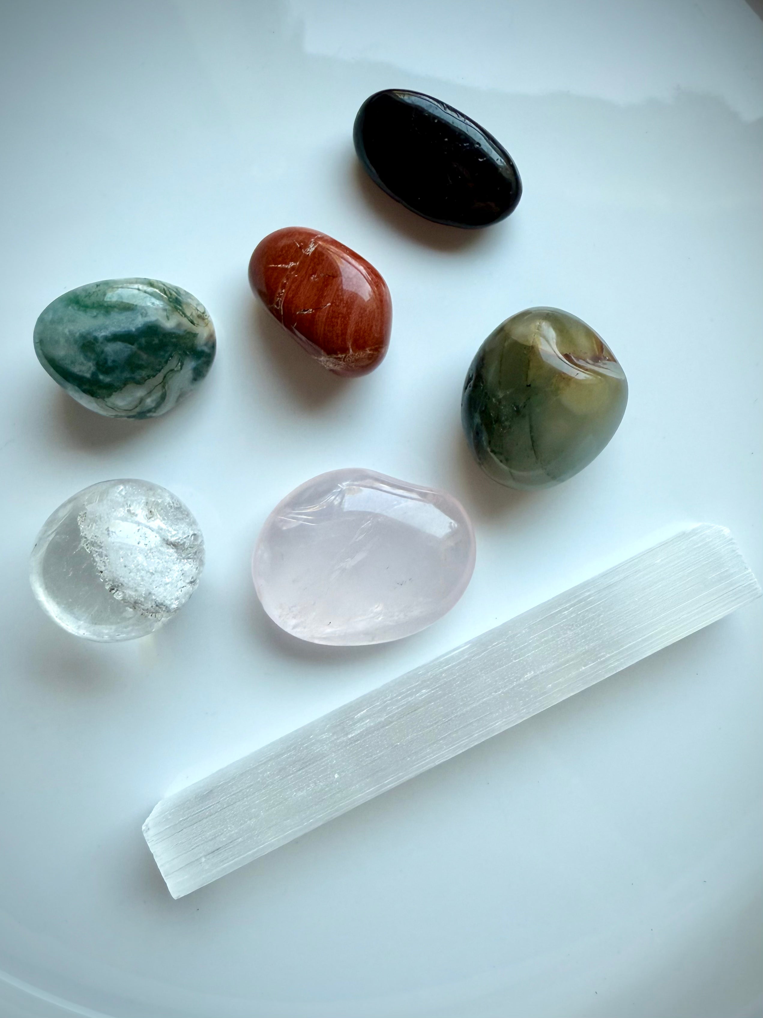 Get Well crystals with natural variation in size and color, shown on white background