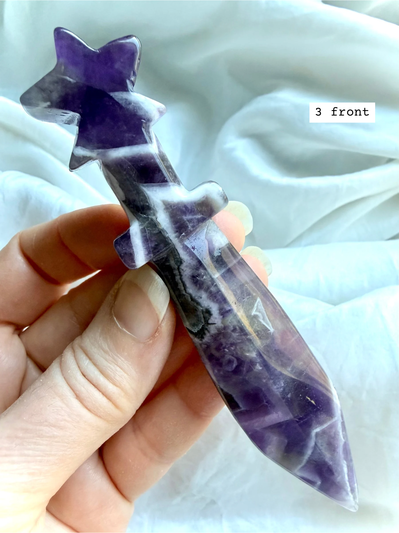 Dream Amethyst crystal star knife carving with purple chevron banding and celestial star handle