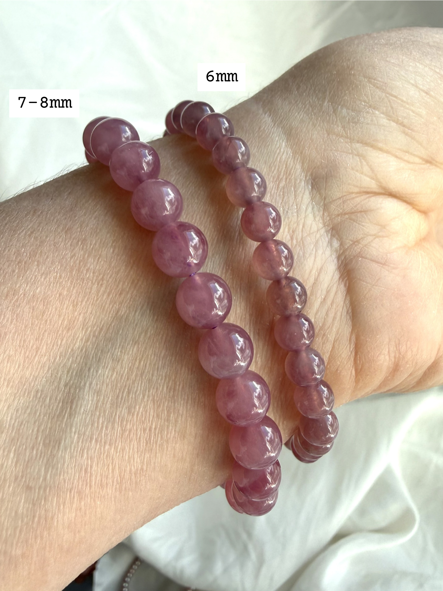 Lavender Rose Quartz Bracelets in two bead sizes on wrist with luminous gemstone beads for Heart Chakra healing
