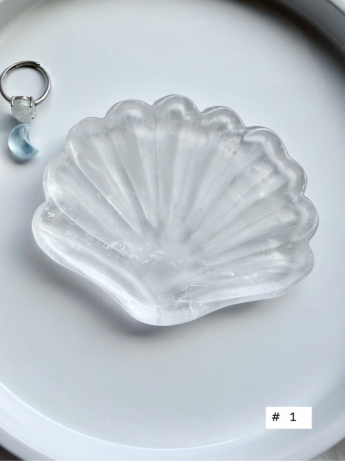 Clear Quartz shell bowl, individual piece #1, showing natural crystal patterns and polished scallop carving.
