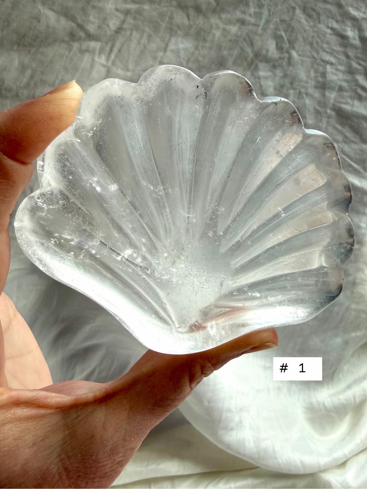 Clear Quartz shell bowl, individual piece #1, showing natural crystal patterns and polished scallop carving.