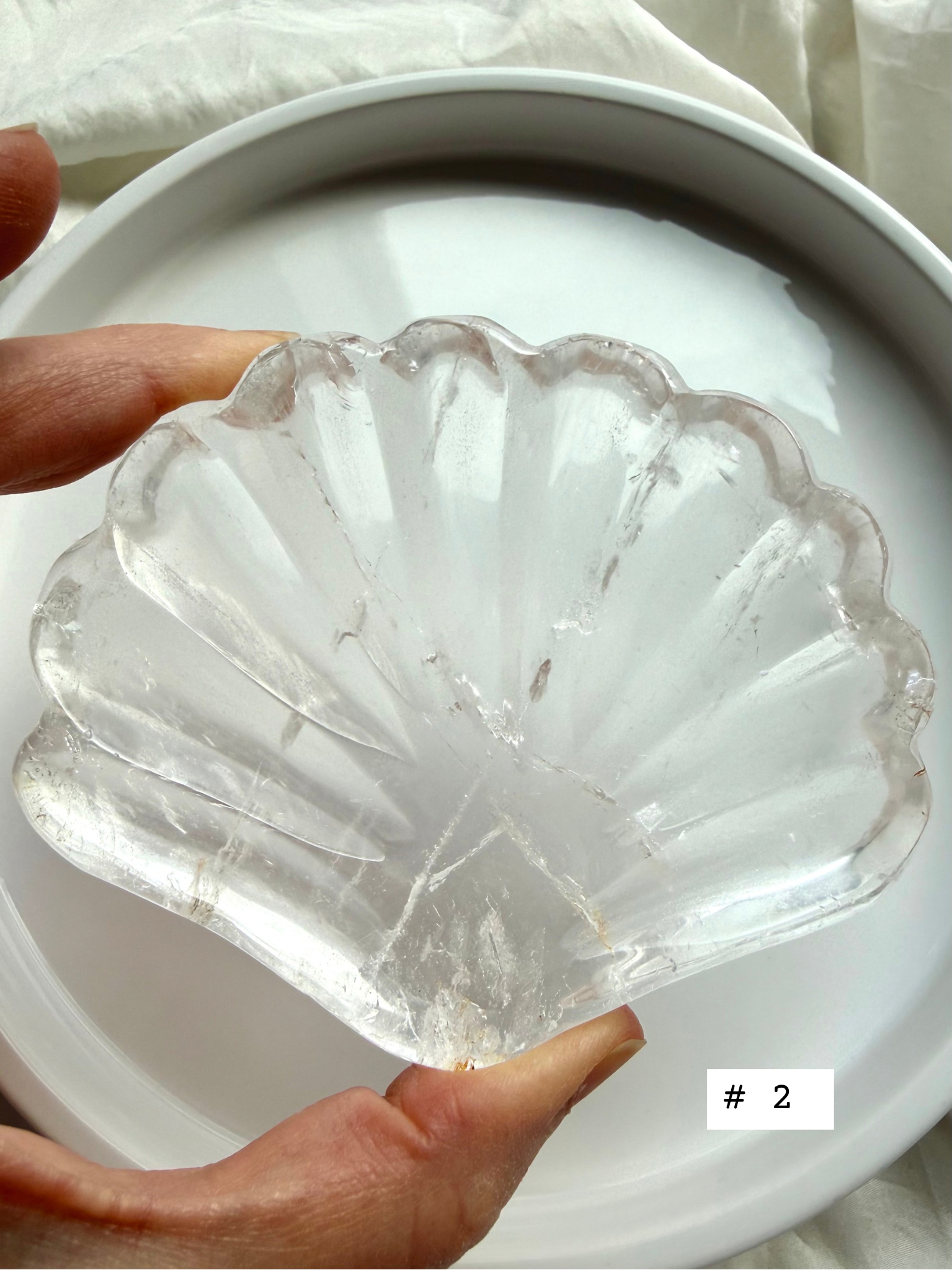 Clear Quartz shell bowl, individual piece #2, showing natural crystal patterns and polished scallop carving.
