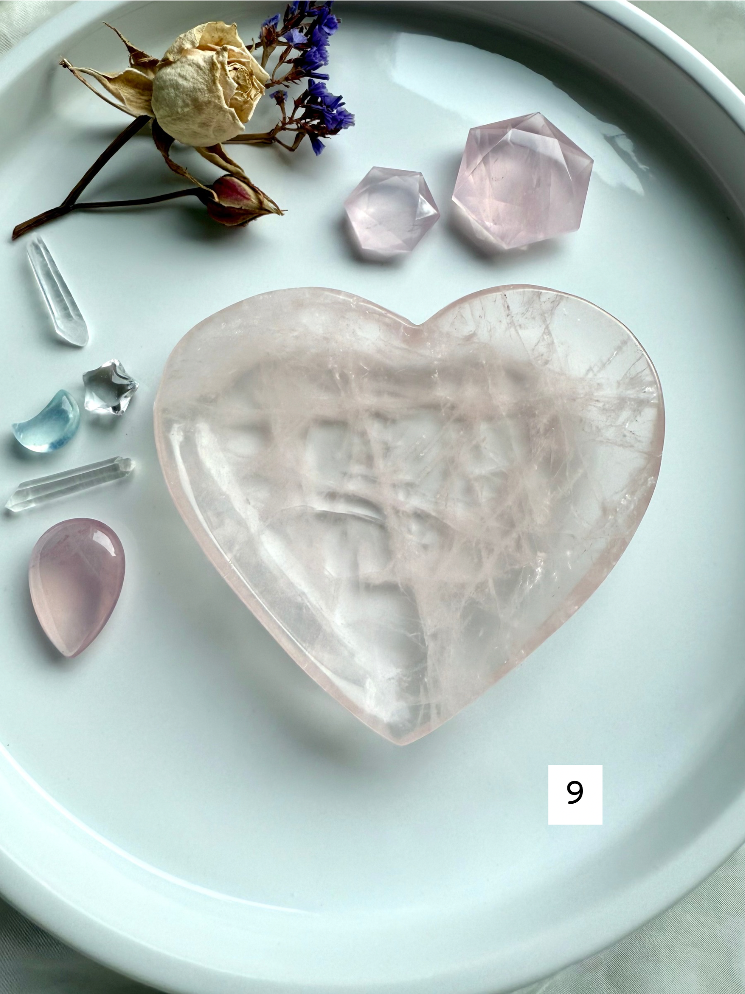 rose quartz heart bowl holding jewelry, styled as a vanity décor piece and heart chakra offering dish for love and emotional healing