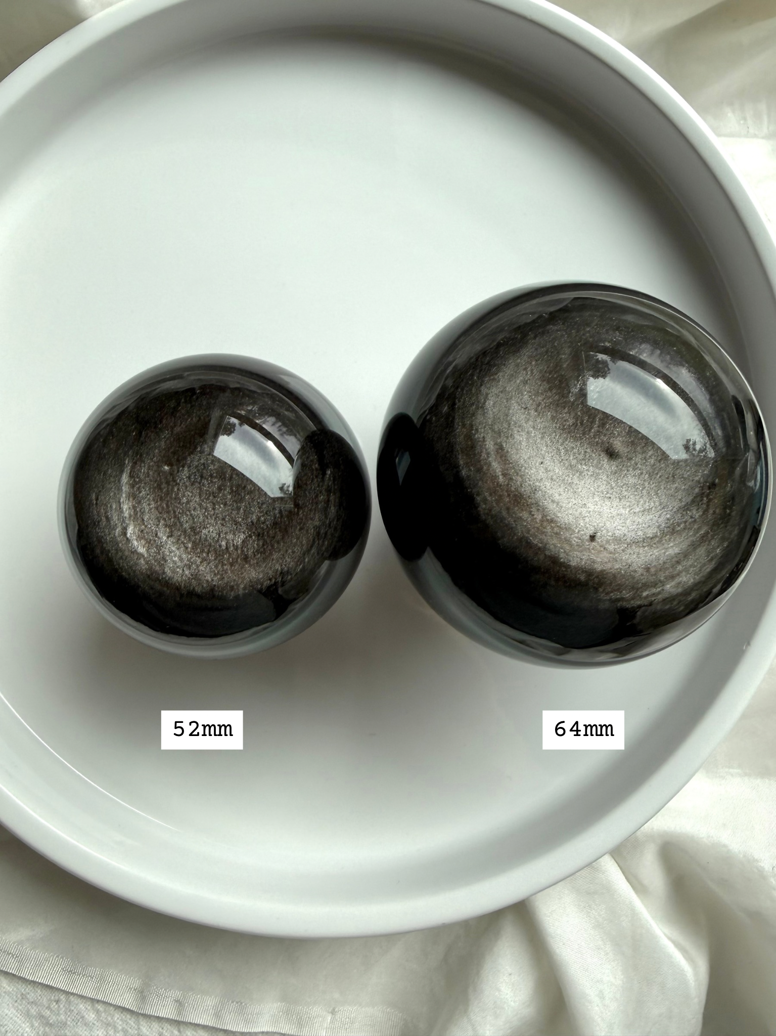Silver Sheen Obsidian spheres in 52mm and 64mm sizes — polished obsidian crystal balls for meditation and energy work