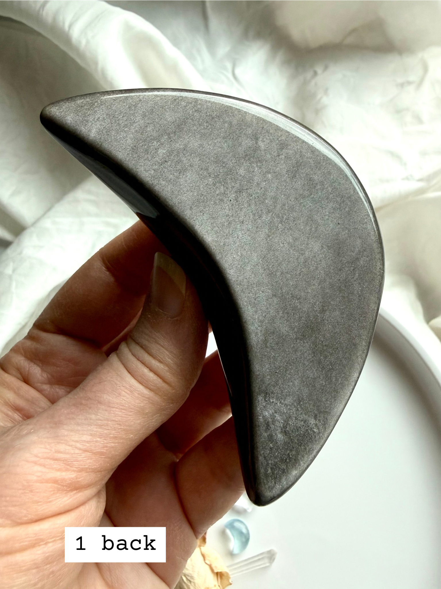 Back view of Silver Sheen Obsidian crescent moon crystal, smooth polished obsidian for grounding and protection