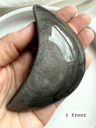 Close-up of Silver Sheen Obsidian crescent moon showing metallic silver shimmer, protective grounding crystal