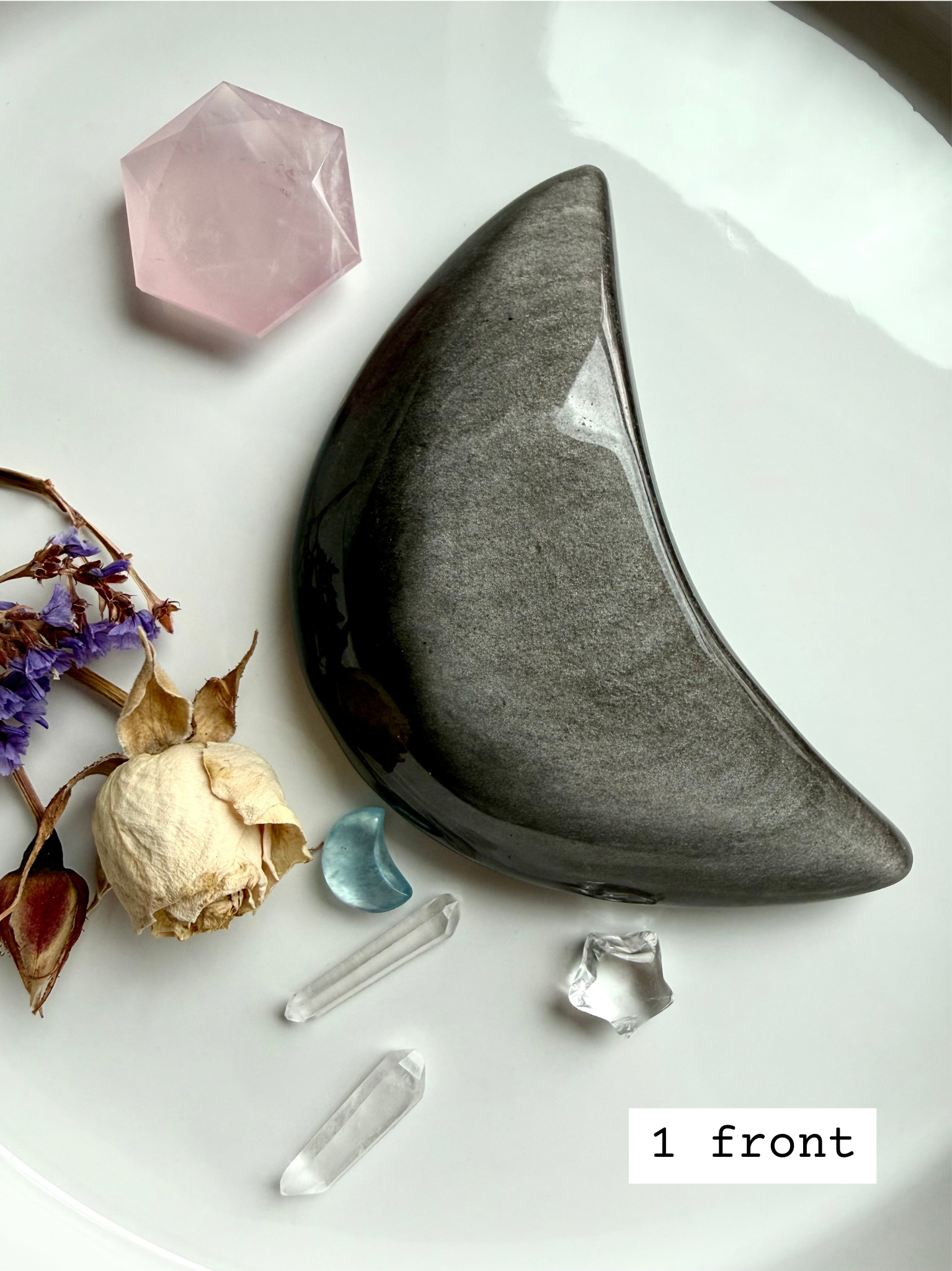 Silver Sheen Obsidian crescent moon on altar tray with clear quartz, protective crystal for insight and spiritual grounding