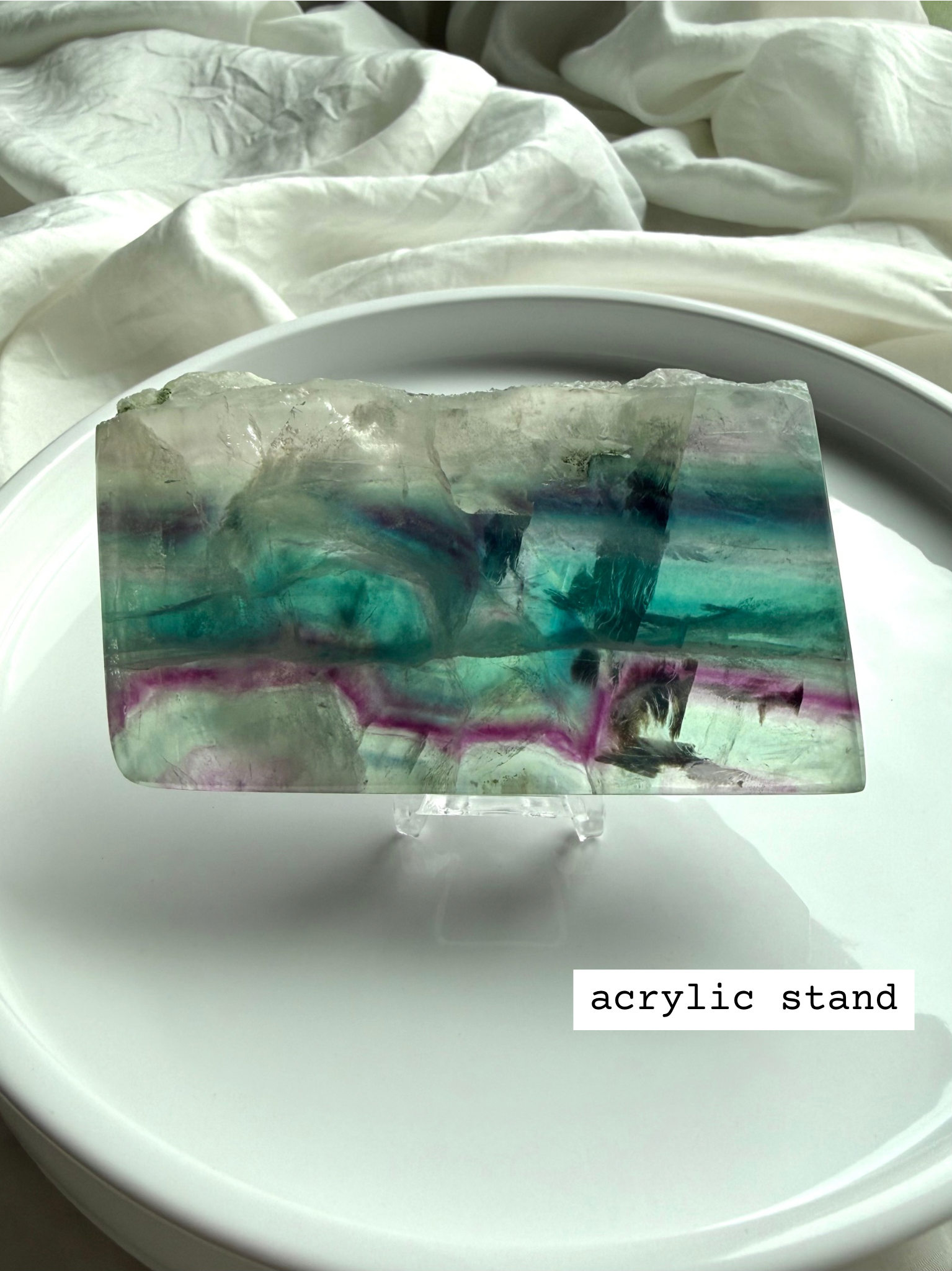 One of a kind fluorite slab shown on complimentary stand