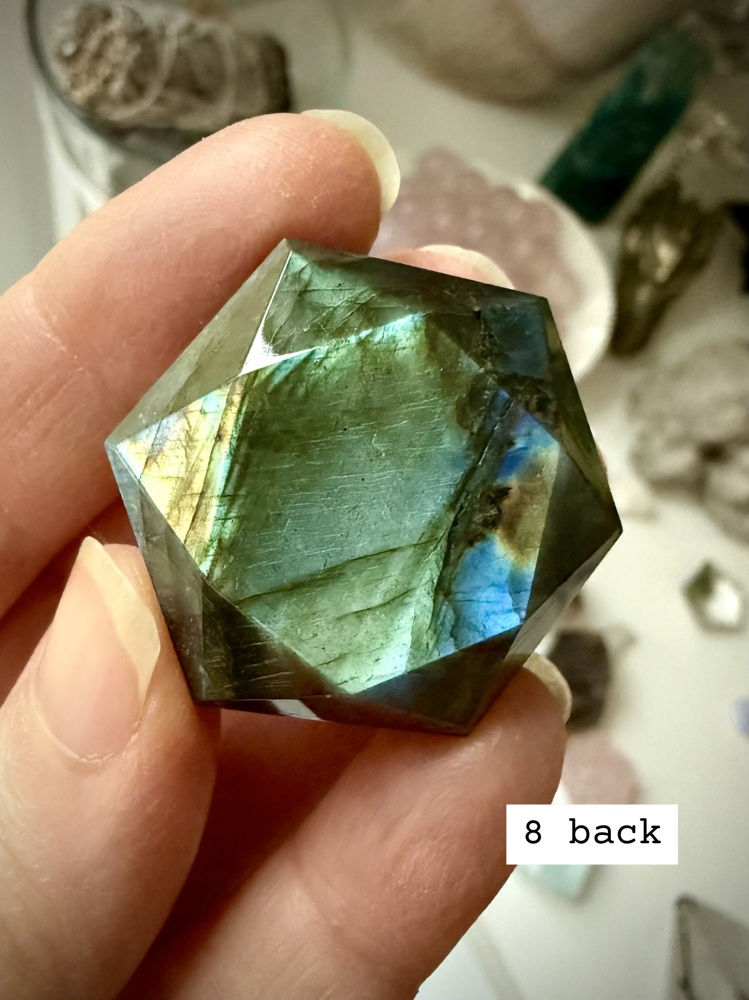 Faceted Labradorite hexagon crystal – sacred geometry hexagon for intuition, luminous green and blue flash, back view