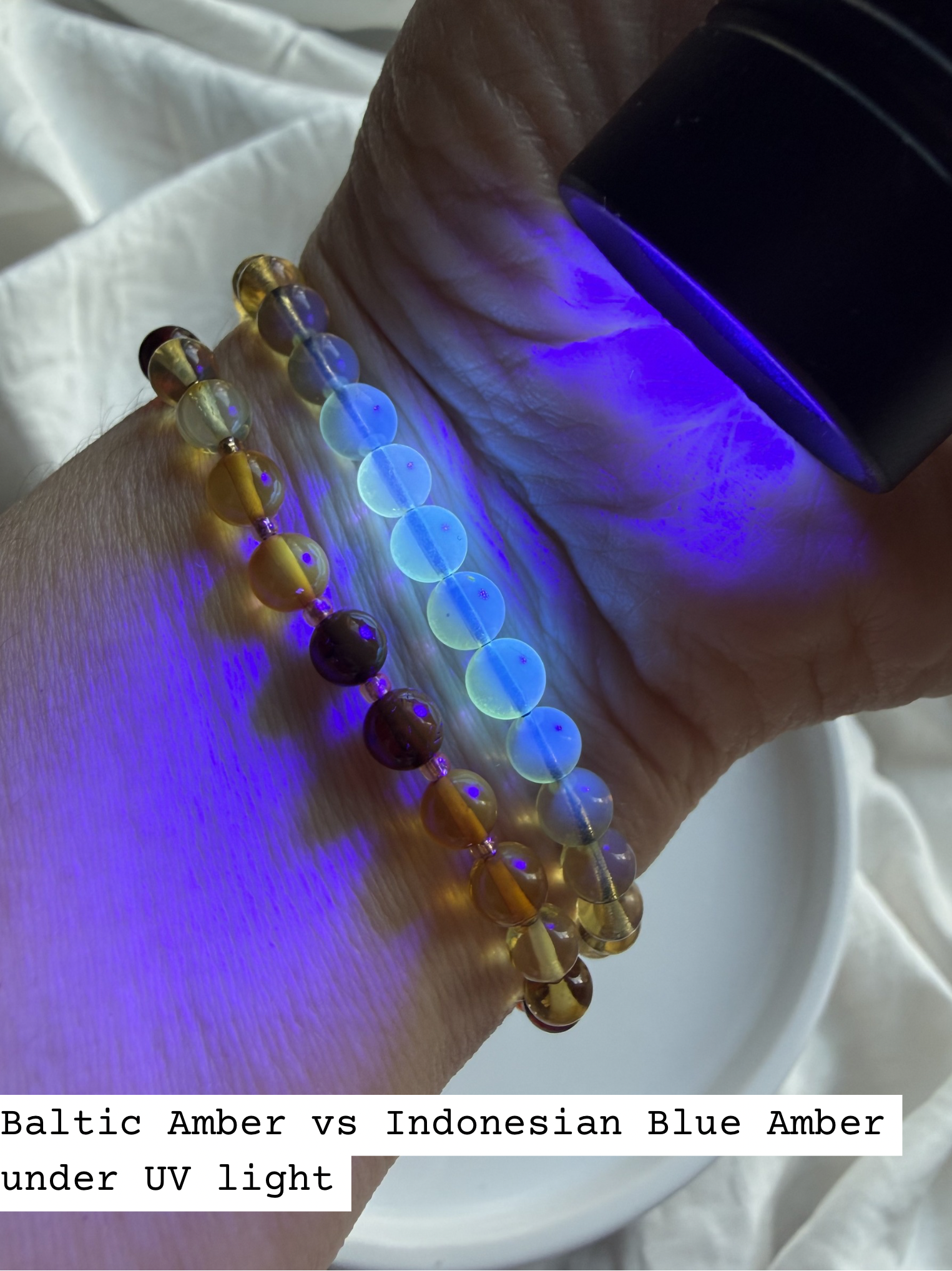 Baltic amber and Indonesian blue amber bracelets under UV light showing natural fluorescence comparison