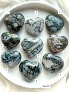 moss agate heart carvings options 1 through 9 front view choose your favorite crystal hearts with natural green inclusions and patterns