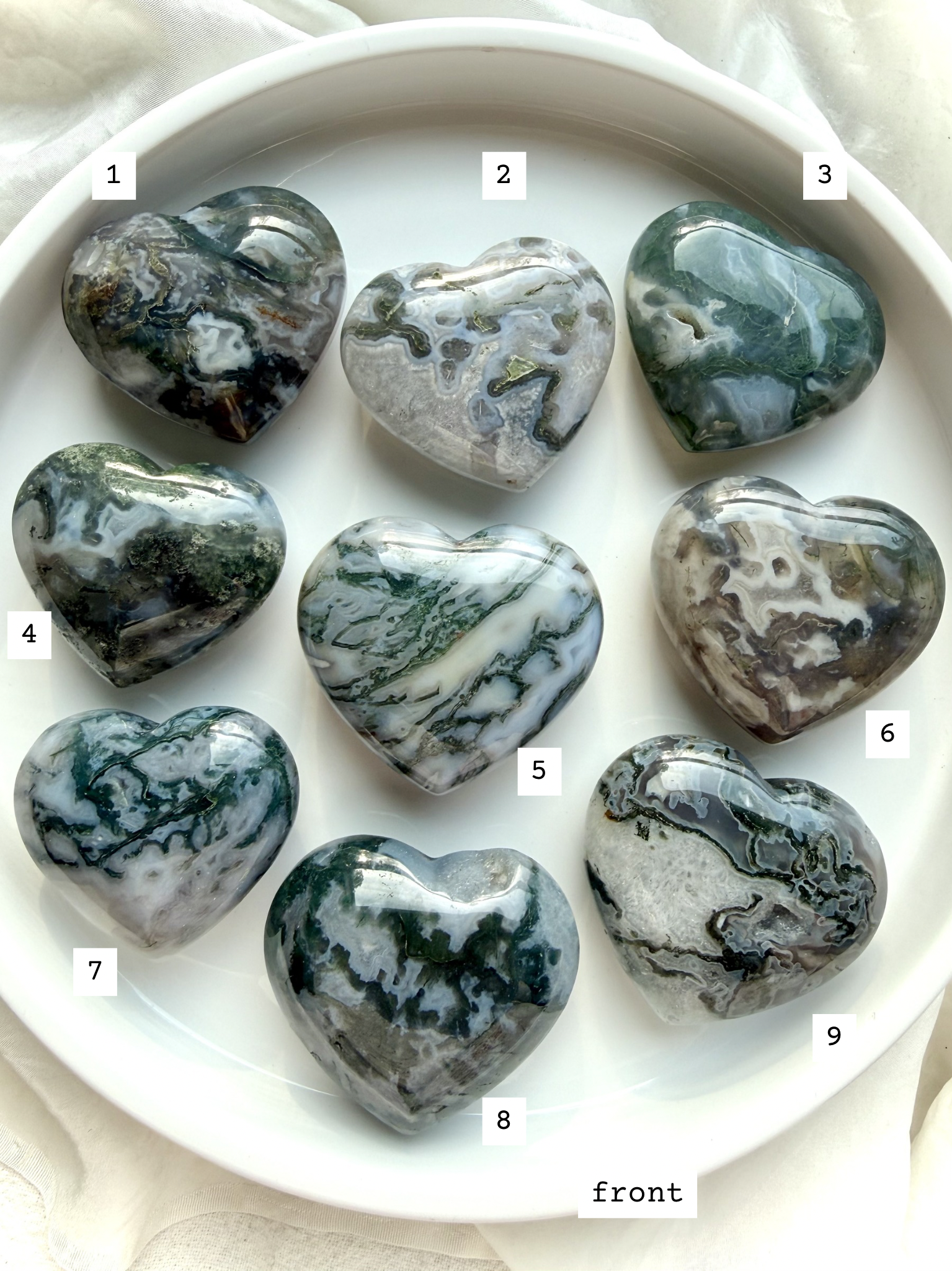 moss agate heart carvings options 1 through 9 front view choose your favorite crystal hearts with natural green inclusions and patterns