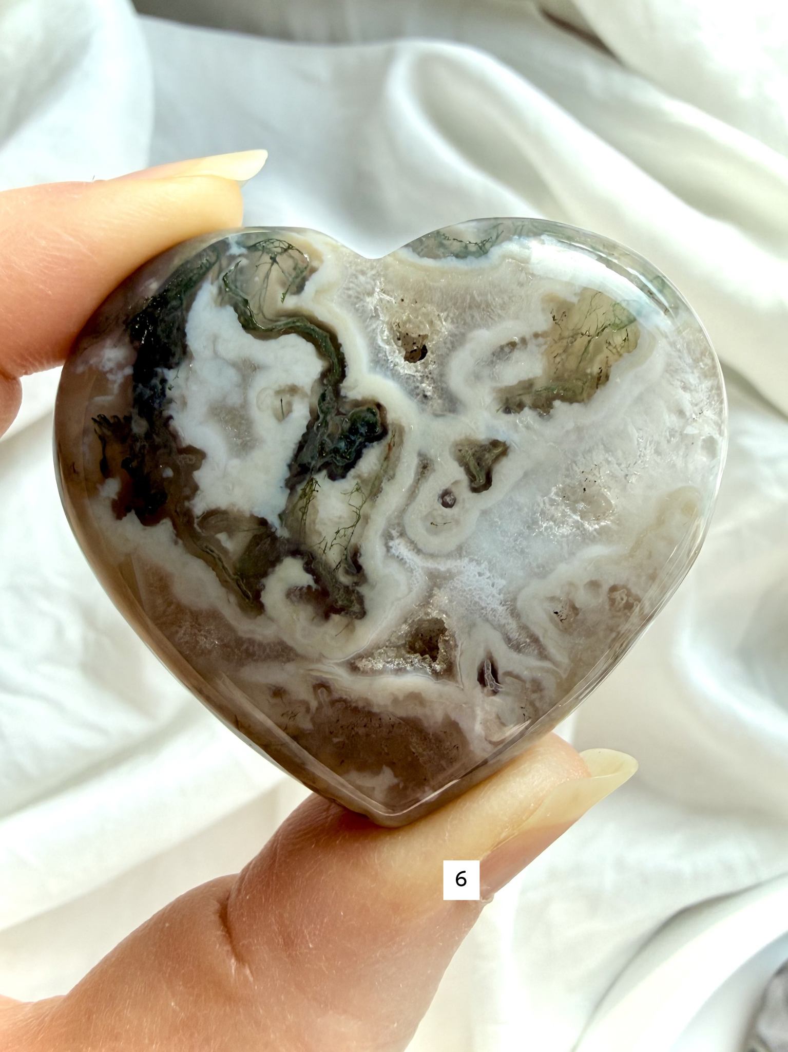 moss agate heart carving option 6 in hand with mossy green formations and polished crystal surface