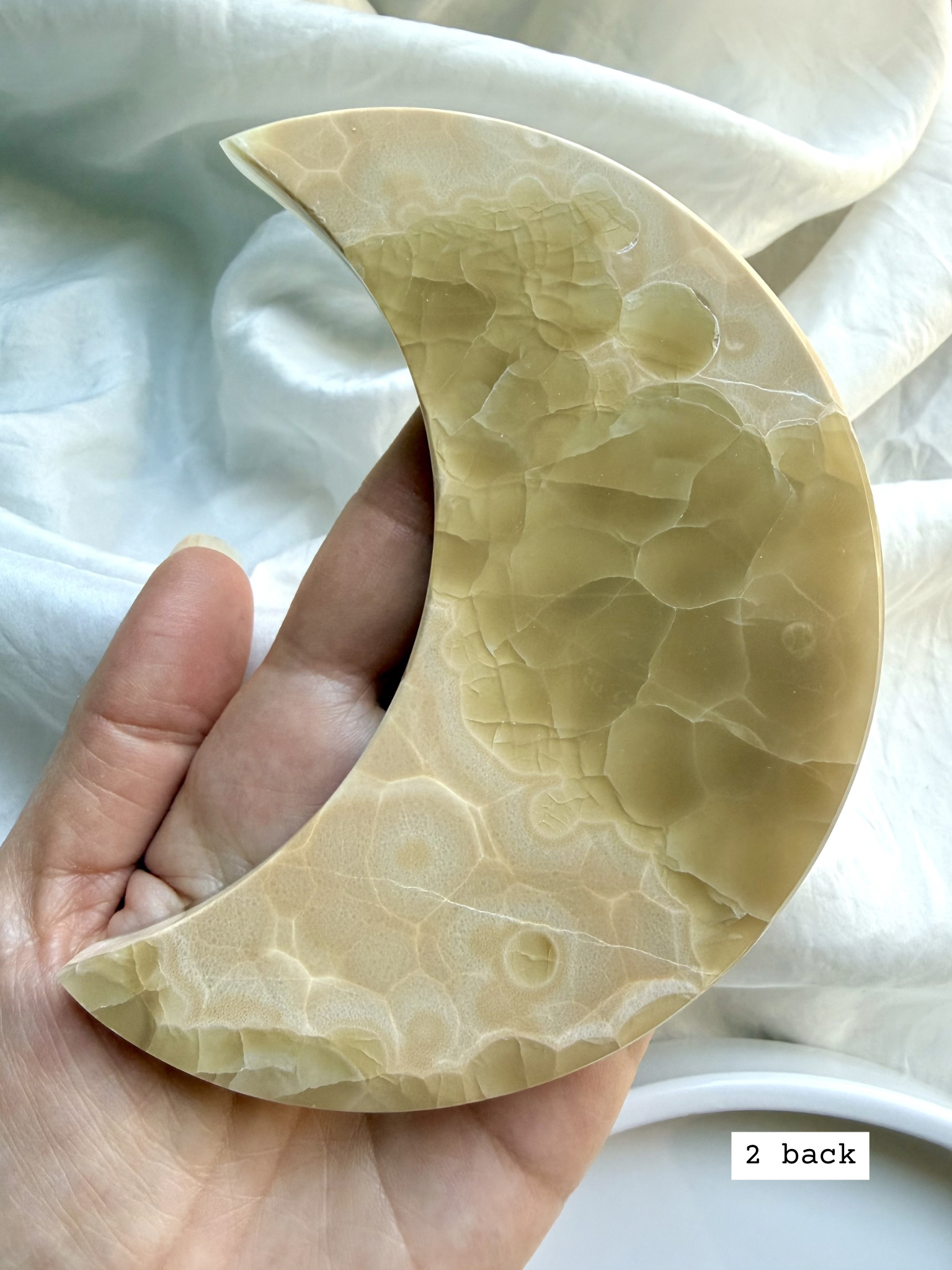 white onyx crescent moon plate # 2 back natural Mexican onyx crystal showing banding and earthy pattern