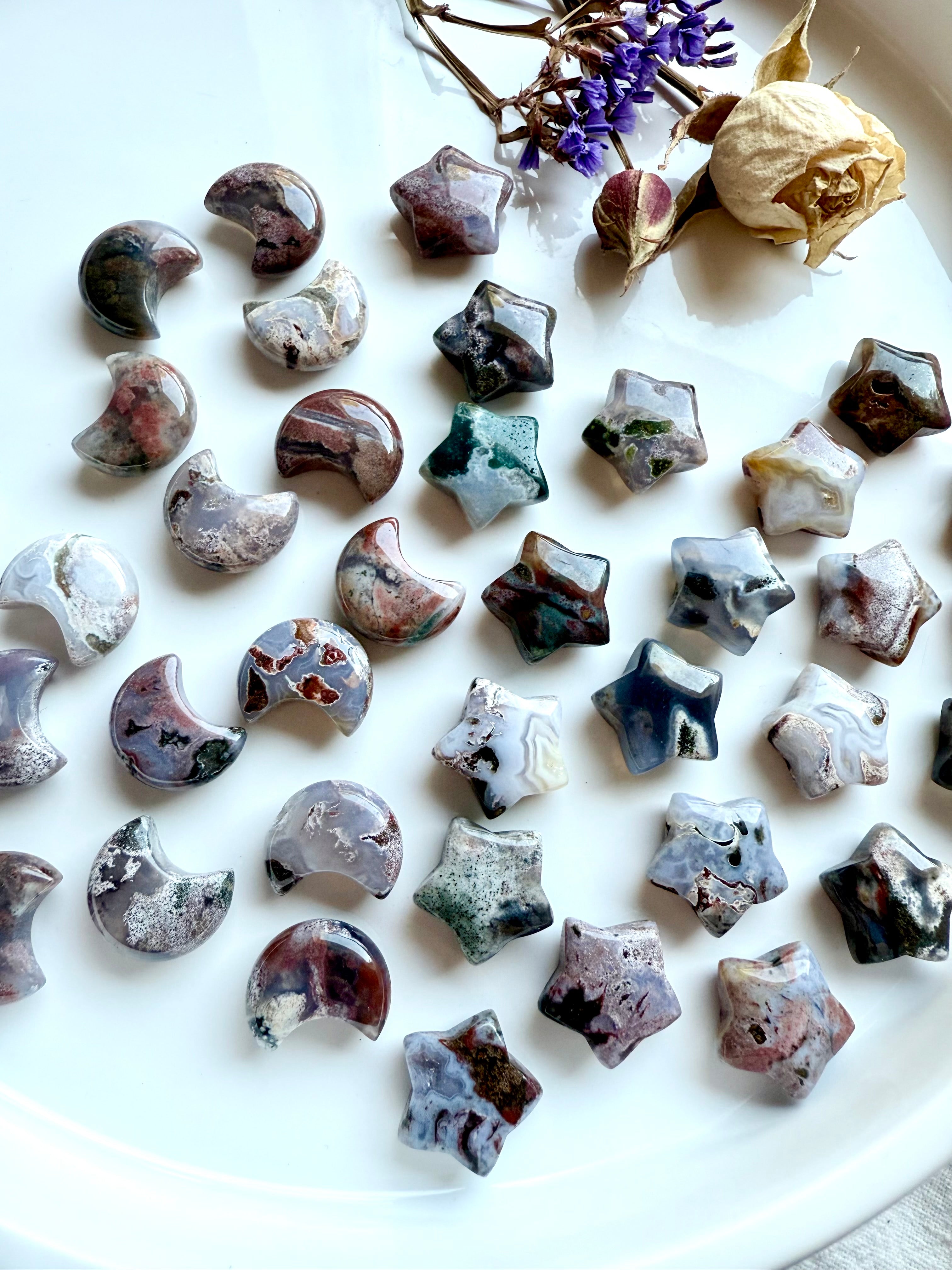 Ocean Jasper mini moons and stars with multi-colored patterns in green, lavender, brown, and cream — celestial healing crystals