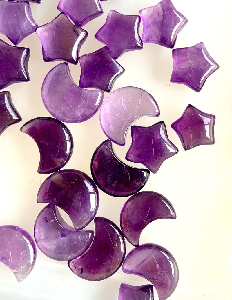 Mini amethyst moon + stars on a translucent background to show the clarity & quality of the crystal
