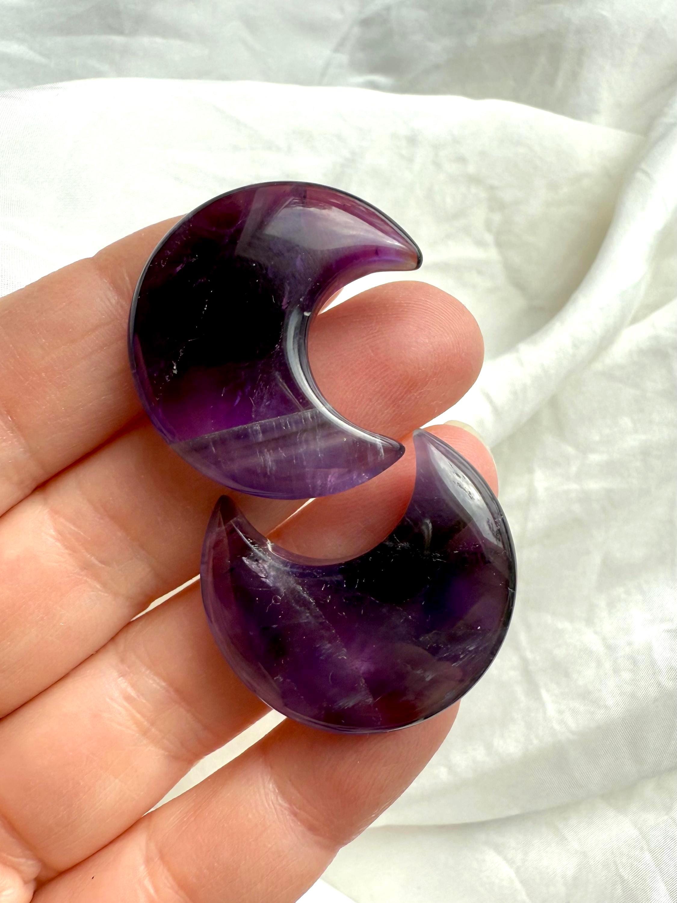 High quality deep purple Dream Amethyst Moons shown on my fingertips for scale