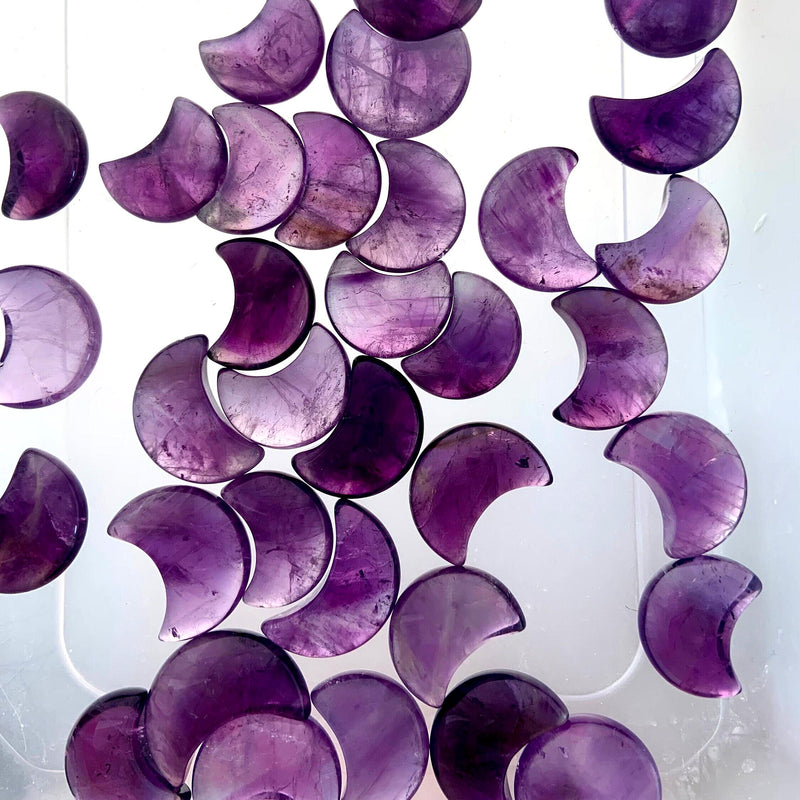 Mini amethyst moons on a translucent background to highlight the clarity & quality of the crystal