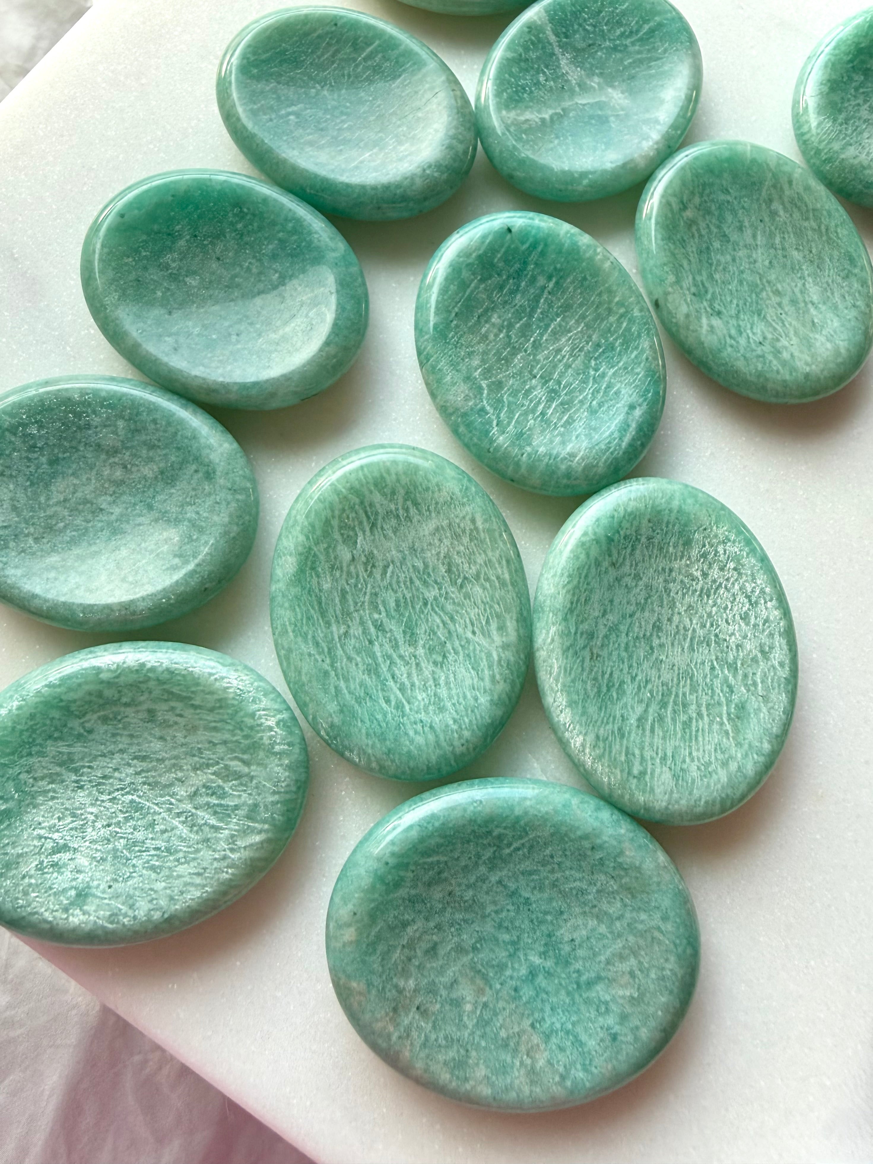 Amazonite worry stones featuring soothing turquoise-green coloring, natural white veining and polished oval thumb stones for calm and communication