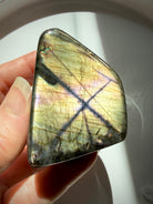Rare Golden Labradorite crystal freeform featuring radiant champagne-gold flash, subtle purple shimmer and distinctive natural markings