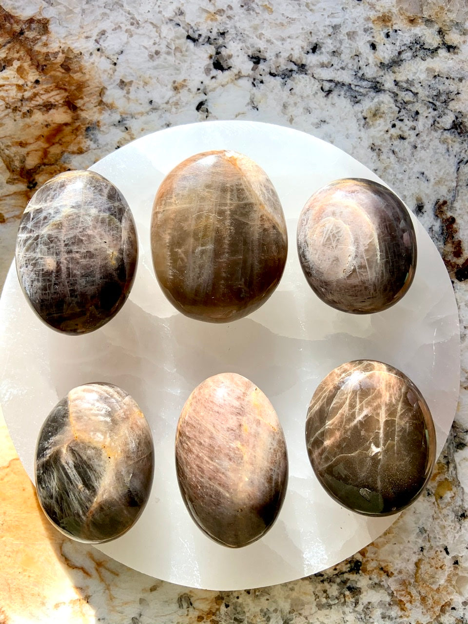 Hold a Black Moonstone Palm Stone to connect with New Moon energy and awaken your inner goddess