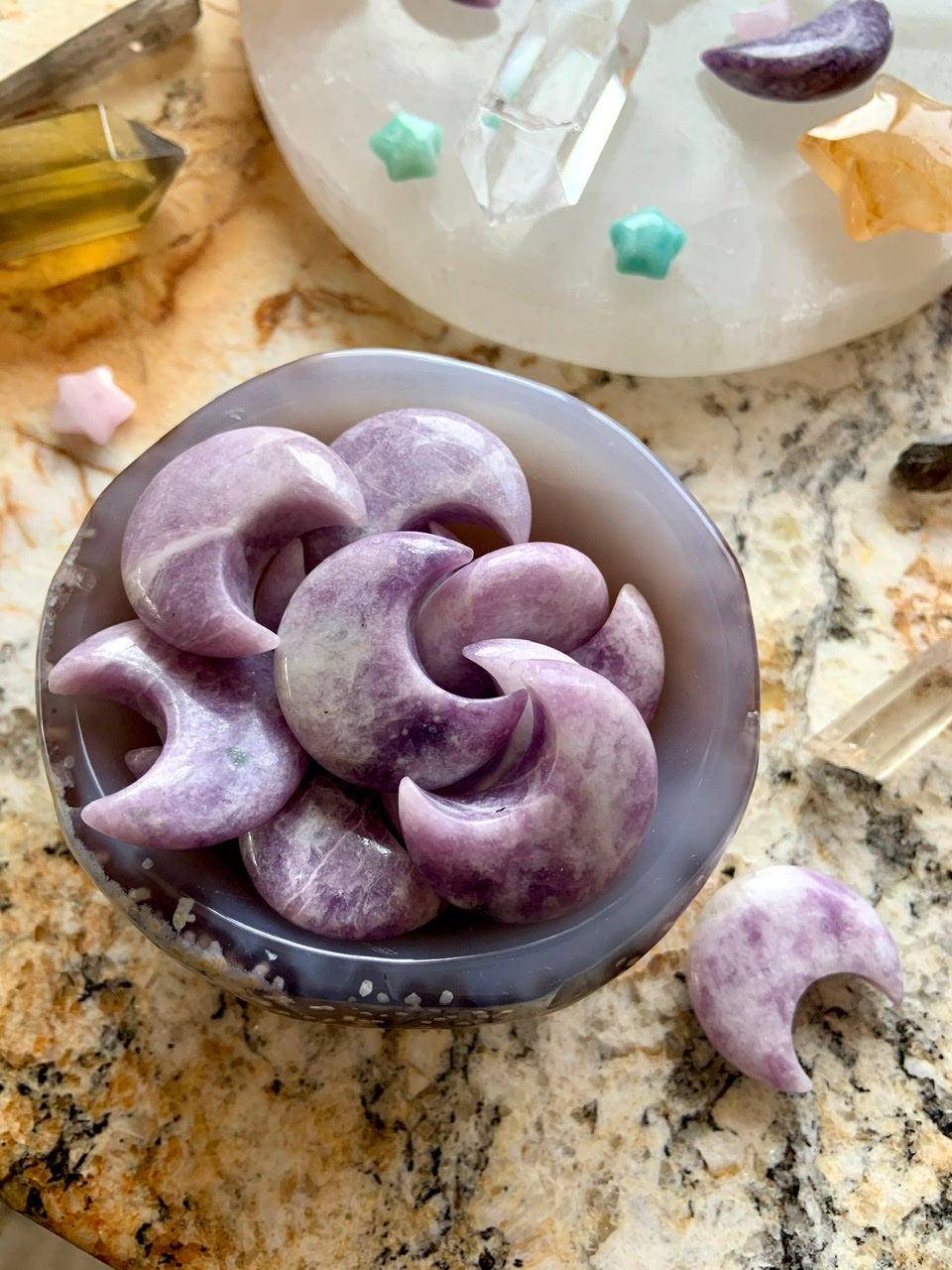 lilac lepidolite crescent moons in a bowl – calming purple crystals for ritual or healing decor