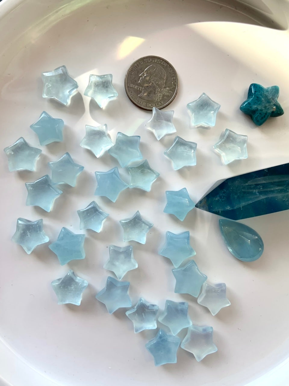 Luminous blue Aquamarine carvings reflecting natural light