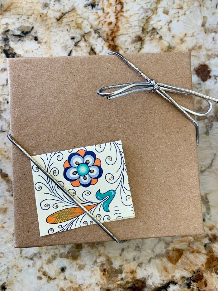 Jewelry gift box with metallic bow — perfect for gifting your Orca Agate bracelet