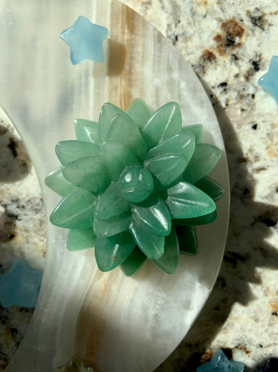 Green Aventurine succulent carving on a black onyx plate with Aquamarine star — heart chakra crystal for emotional healing & balance.