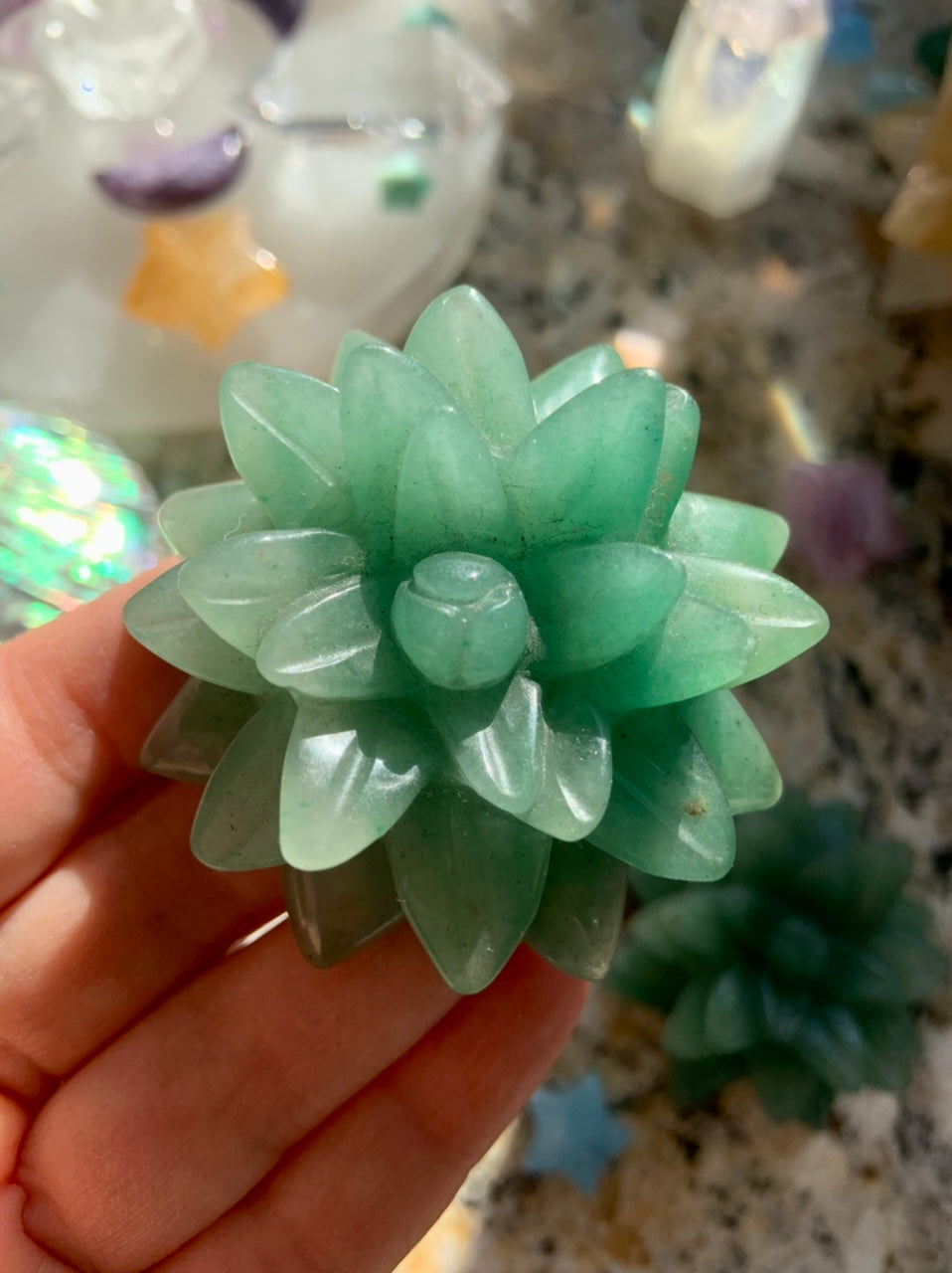 Green Aventurine crystal succulent carving held in hand — vibrant green stone for abundance, heart chakra healing & crystal gifting.