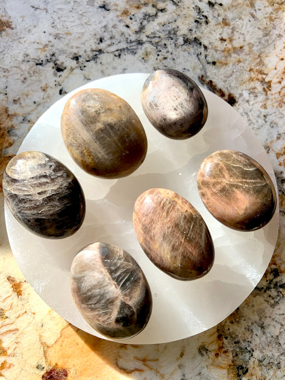 Hold a Black Moonstone Palm Stone to connect with New Moon energy and awaken your inner goddess