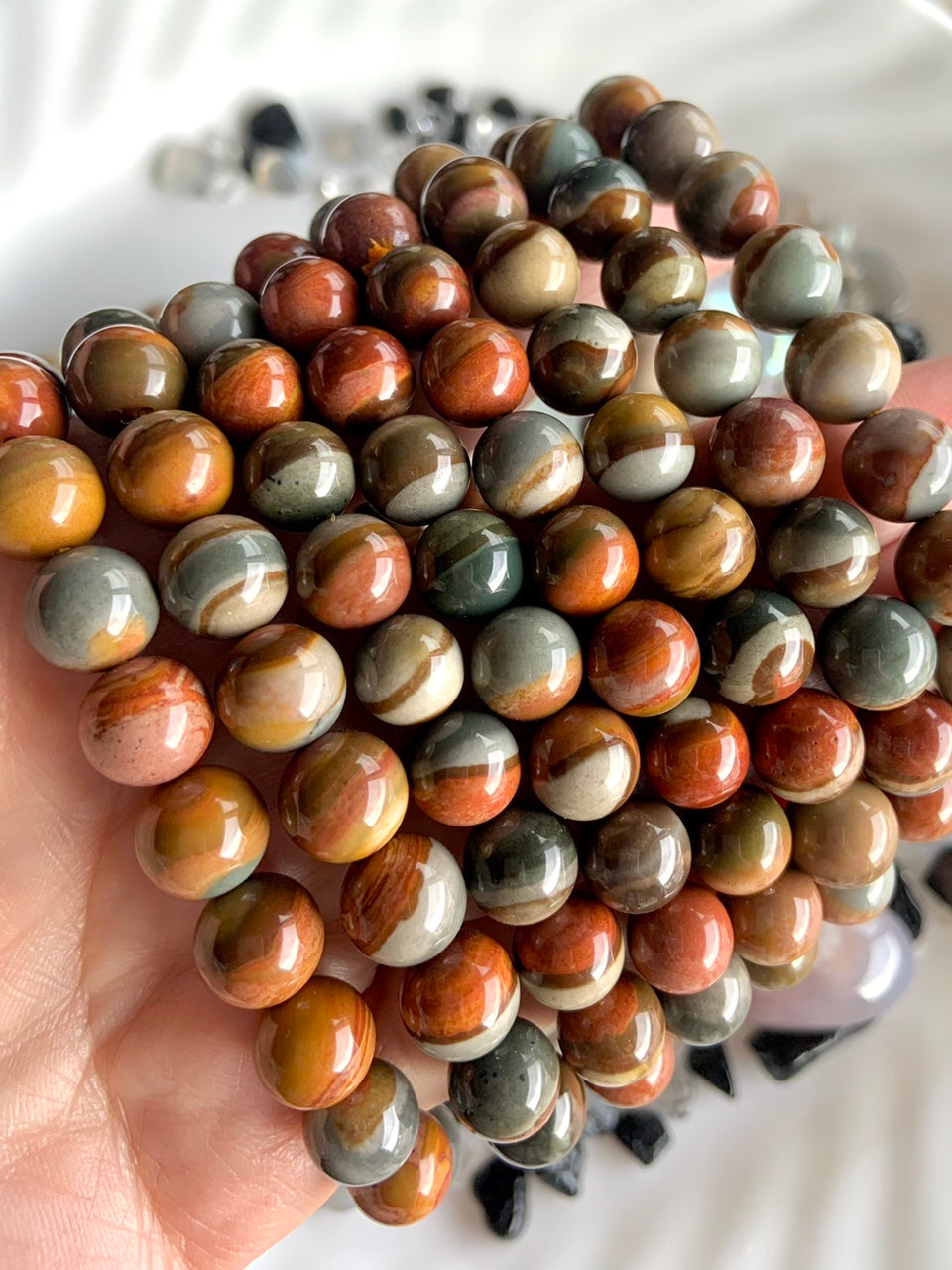 Wear your Polychrome Jasper bracelets to open the Root Chakra with a calming, grounding energy 