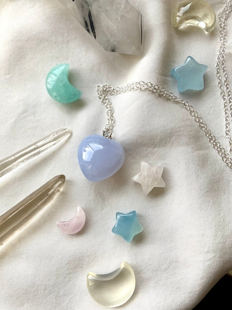 A luminous blue chalcedony heart pendant necklace on s925 silver chain makes a sweet gift her. This pastel blue crystal resonates with the throat + heart chakras promoting clear, emotionally balanced, heart-centered communication + understanding.