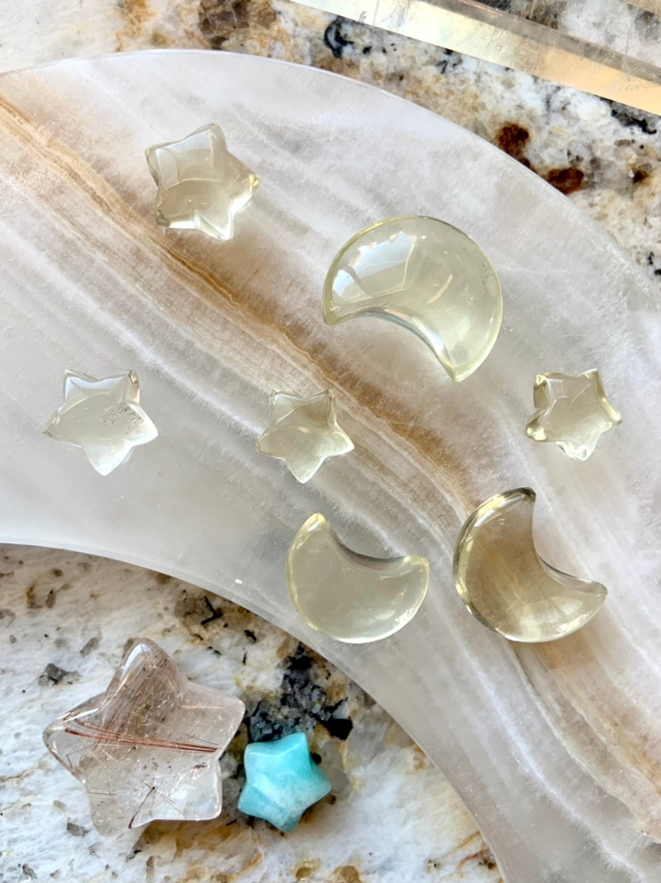 Citrine star and moon carvings on a stone moon dish with healing crystals — mini citrine carvings for chakra work and crystal grids