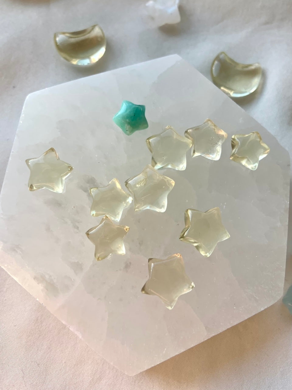 Mini citrine star carvings on a selenite plate with Amazonite — crystal stars for joy, clarity, and Solar Plexus chakra energy