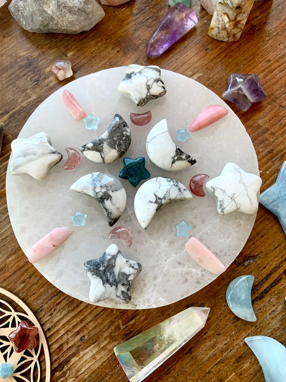 Alternate view of crystal grid with Strawberry Quartz moons, Howlite carvings, Pink Opal, Aquamarine stars, and Apatite centerpiece — energy tools for spiritual alignment